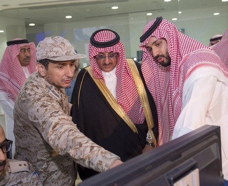 Defence Min. Prince Mohammad bin Salman (R) and Interior Min. and Deputy Crown Prince Mohammed bin Nayef are briefed by officers on the military operations in Yemen. 