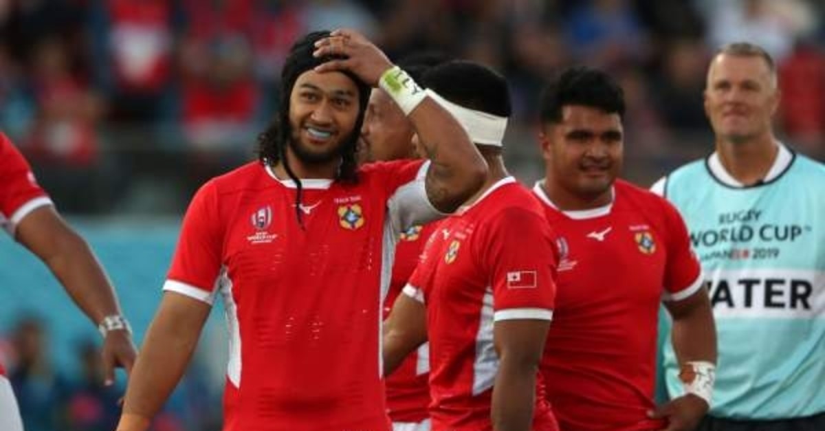 Tonga's flanker Zane Kapeli (L) reacts after the match against the United States, Oct. 13, 2019. (AFP Photo)  