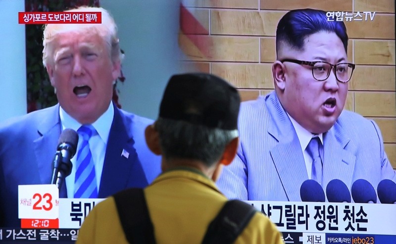 n this May 13, 2018, file photo, a man watches a TV screen showing file footage of U.S. President Donald Trump, left, and North Korean leader Kim Jong Un during a news program at the Seoul Railway Station in Seoul, South Korea. (AP Photo)