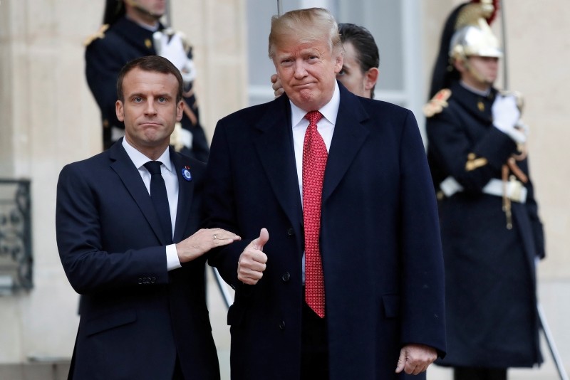 French President Emmanuel Macron (L) greets US President Donald J. Trump upon his arrival at the Elysee Palace in Paris, France, Nov. 10, 2018. (EPA Photo)