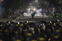 Supporters of Indonesian presidential candidate Prabowo Subianto clash with the police in Jakarta, Indonesia, early Wednesday, May 22, 2019. (AP Photo)