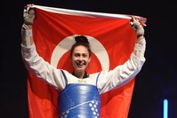 u0130rem Yaman poses with flag after her win at World Taekwondo Championship, May 19, 2019.