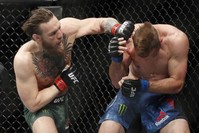 McGregor hits Cerrone during the UFC 246 welterweight mixed martial arts bout in Las Vegas, Jan. 18, 2020. (AP Photo)