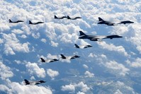In this Sept. 18, 2017, file photo provided by South Korea Defense Ministry, U.S. Air Force B-1B bombers, F-35B stealth fighter jets and South Korean F-15K fighter jets fly over the Korean Peninsula during joint drills. (South Korea Defense Ministry via AP)
