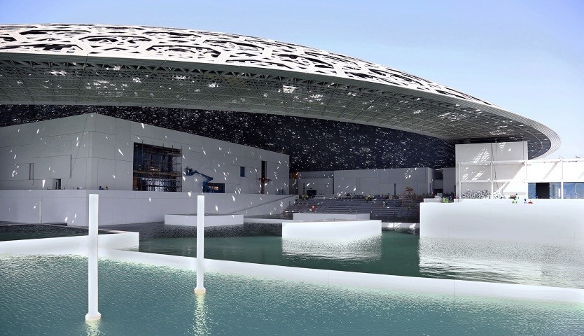 Abu Dhabiu2019s Louvre museum, designed by French architect Jean Nouvel, surrounded by sea water. 