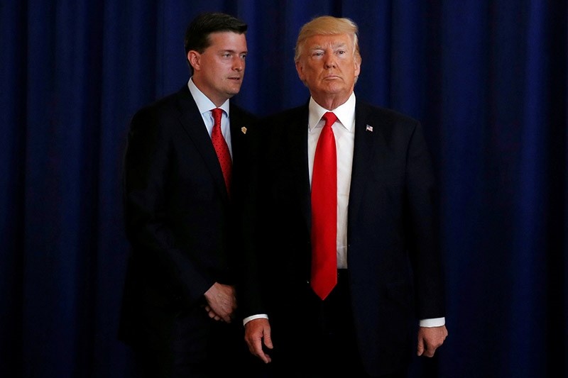 White House Staff Secretary Rob Porter (L) reminds U.S. President Donald Trump he had a bill to sign after he departed quickly following remarks at his golf estate in Bedminster, New Jersey U.S., August 12, 2017. (Reuters Photo)