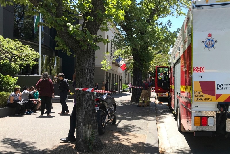 Firefighters, right, are seen outside the Indian and French consulates on St Kilda Road in Melbourne, Wednesday, Jan. 9, 2019 (AP Photo)