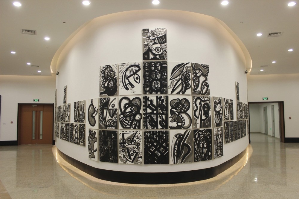 An installation by Haitian artist Philippe Dodard's ,La Movement en Memoire,, stands like a ship inside a gallery of contemporary African art and contemporary art.