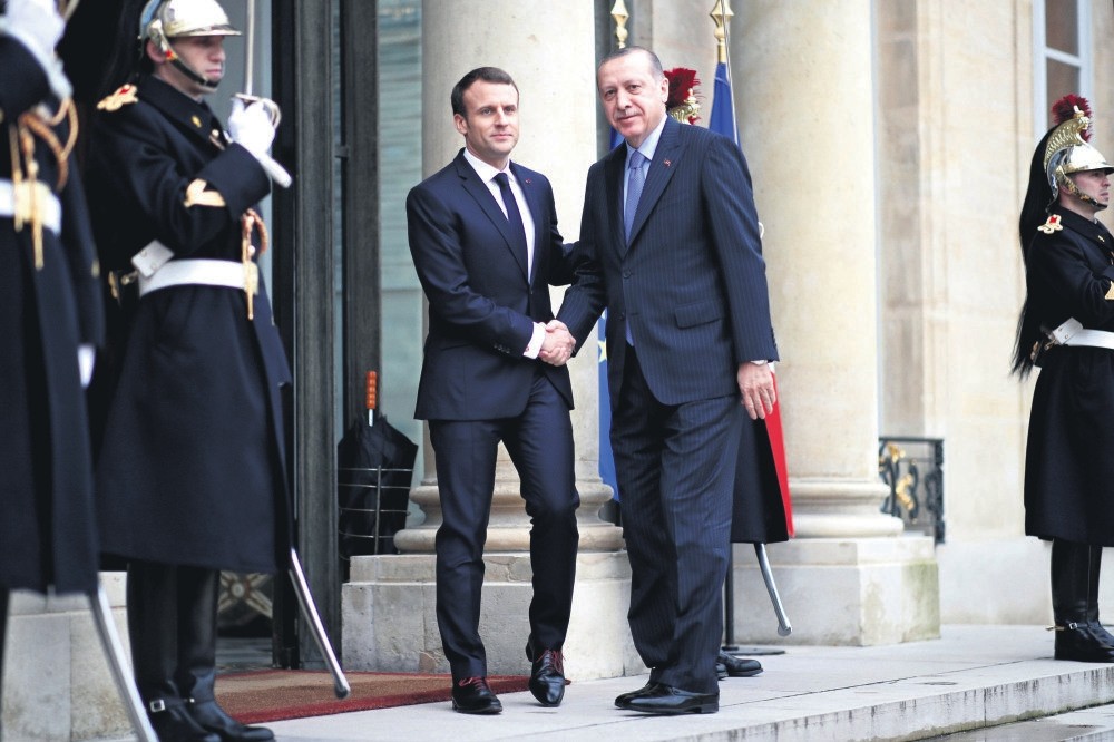 French President Emmanuel Macron (L) welcomes President Erdou011fan at the Elysee Palace, Paris, Jan. 5. 