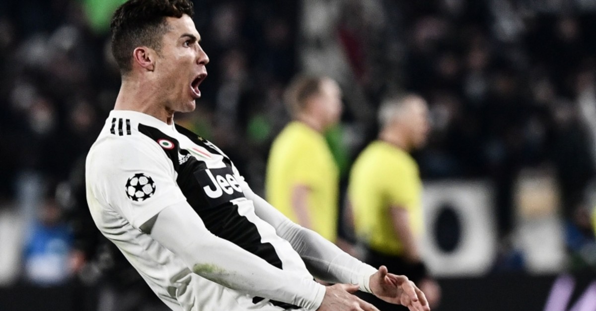 Juventus' Cristiano Ronaldo celebrates after scoring his side's third goal during the Champions League round of 16, 2nd leg, football match between Juventus and Atletico Madrid at the Allianz stadium in Turin, Italy, March 12, 2019. (AFP Photo)