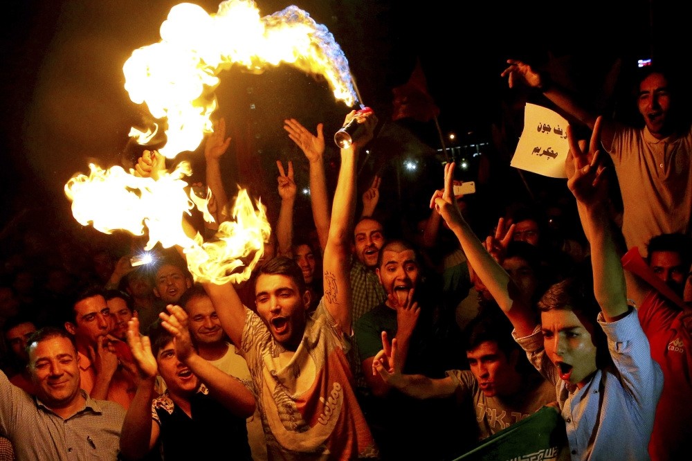 Iranians celebrate following a landmark nuclear deal in Tehran, Iran, July 14, 2015. Since becoming president early last year, Donald Trump has supported Israel and the Gulfu2019s anti-Iran agenda and has attacked the nuclear deal.
