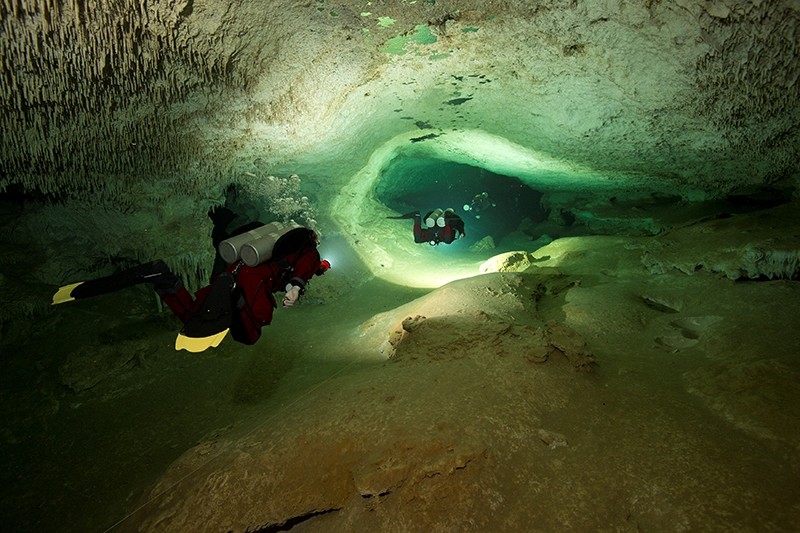 Scuba divers tour an authorized area of Sac Aktun underwater cave system as part of the Gran Acuifero Maya Project near Tulum, in Quintana Roo state, Mexico (Reuters File Photo)