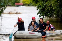 Fire fighters of Istanbul Metropolitan Municipality rescued people who trapped in their house due to flood with boats on July 27.