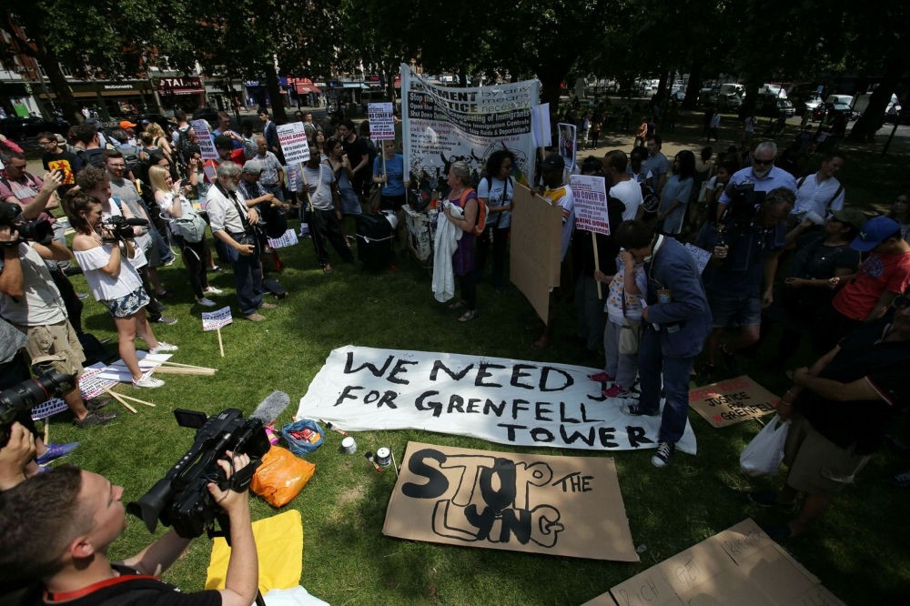 Demonstrators gather in Shepherds Bush in west London to take part in an anti-government protest on June 21.