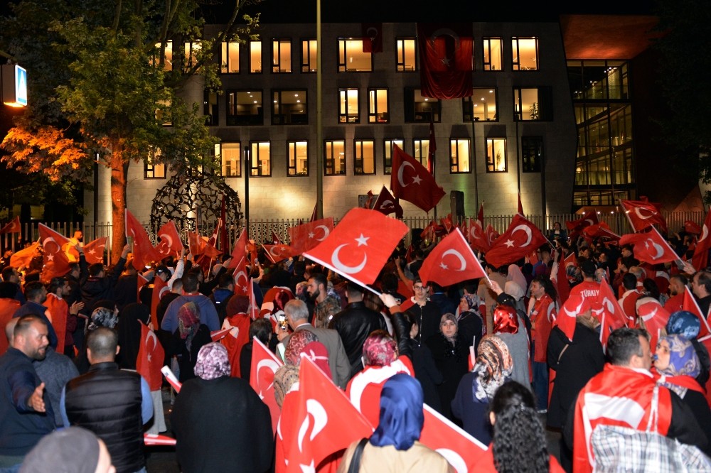 Turkish citizens at a pro-democracy rally outside Berlin embassy to mark the first anniversary of July 15 coup attempt. Germany is accused of harboring suspects involved in the bid.