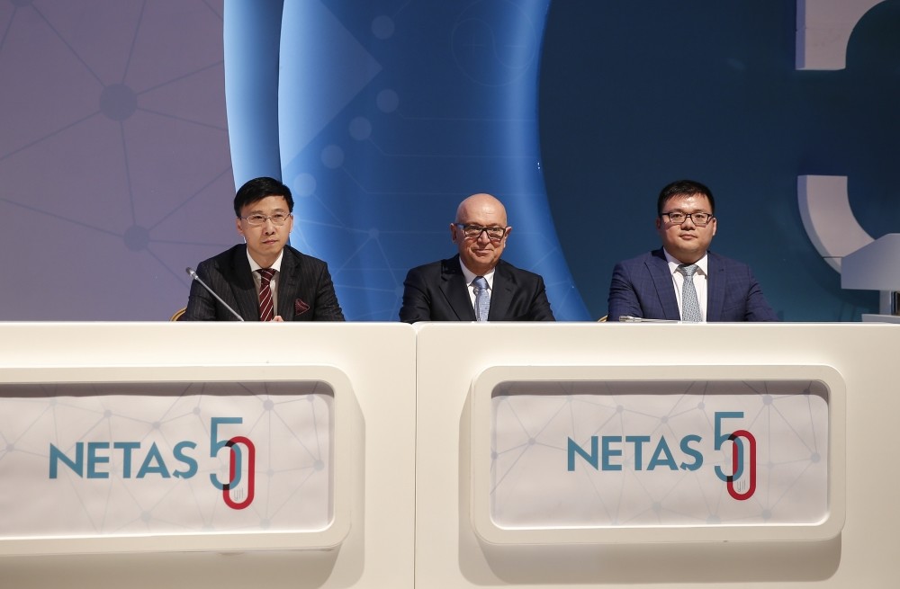 Netau015f CEO Mu00fcjdat Altay (C), ZTE Central and Eastern Europe Executive Vice President Li Ming (R) and ZTE Turkey General Manager Jianbo Wang (L) attend a contract signing ceremony between Chinese ZTE and Turkish telecoms company Netau015f.