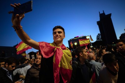 Vox supporters attend an election campaign event in Madrid.