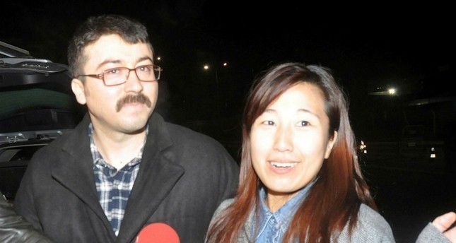Fugitive Hu00fcseyin Korkmaz (L) and his wife after being released in Turkey