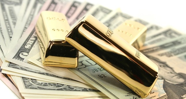 الذهب يتراجع والدولار يرتفع بعد تصريحات مثبطة