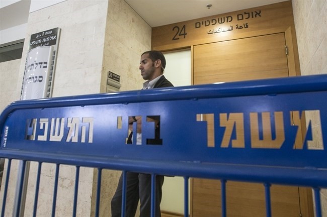 A security officer standing guard outside an Israeli court (File photo / AFP)