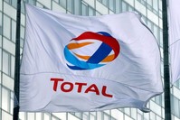 The logo of French oil giant Total on a flag at a financial district near Paris, May 16, 2018. (Reuters Photo)
