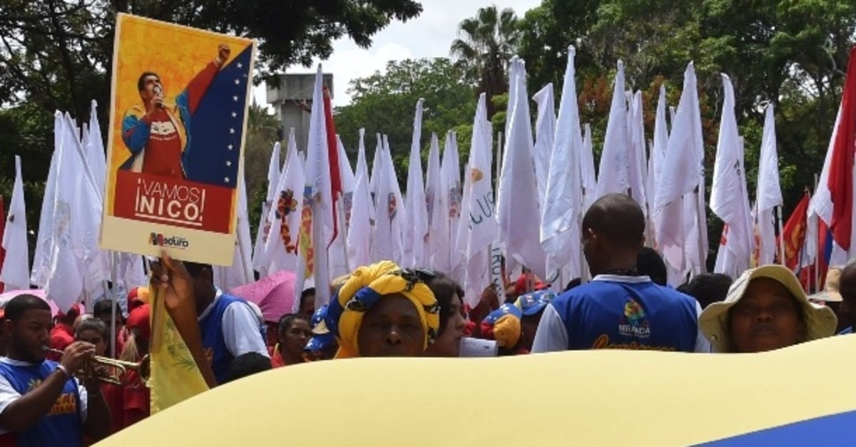 Supporters of Venezuelan President Nicolas Maduro take part in a demonstration in Caracas, April 27, 2019.