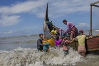 In this Sept. 14, 2017 photo, Rohingya Muslim arrive on a boat from Myanmar to Bangladesh in Shah Porir Dwip, Bangladesh. (AP Photo)