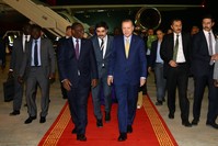 Senegalese President Macky Sall (L) welcomes President Erdou011fan (R) upon his arrival in Senegal, late Wednesday, Feb. 28.
