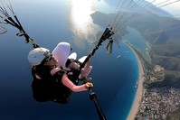A paragliding instructor films a trip down from Mt. Babadau011f.