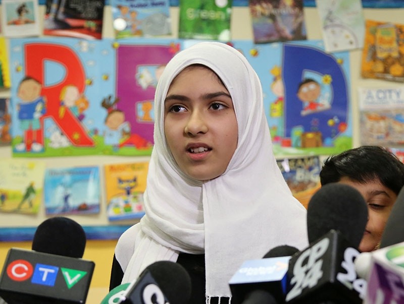 Khawlah Noman, 11, speaks to reporters at Pauline Johnson Junior Public School, after she told police that a man cut her hijab with scissors in Toronto, Ontario, Canada Jan. 12, 2018 (Reuters Photo)