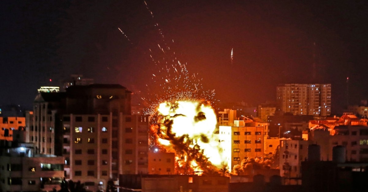 An explosion is seen among buildings during an Israeli airstike on occupied Gaza City, May 4, 2019. 