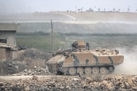 A Turkish military vehicle on the road between the Syrian towns of Tal Abyad and Ayn al-Arab on the Turkish border during the cross-border operation against the Peopleu2019s Protection Units (YPG) terrorist group, Oct. 16, 2019.