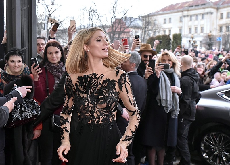 US model, businesswoman and socialite Paris Hilton (C) arrives to the Grand Hotel in Lviv, Western Ukraine, March 31, 2018. (EPA Photo)