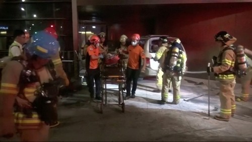 Rescue workers place a man, who had set himself on fire in an apparent protest, onto a stretcher after taking him out of his burnt car in front of the Japanese Embassy in Seoul, South Korea July 19, 2019, in this still image taken from video. (REUTERS Photo) 