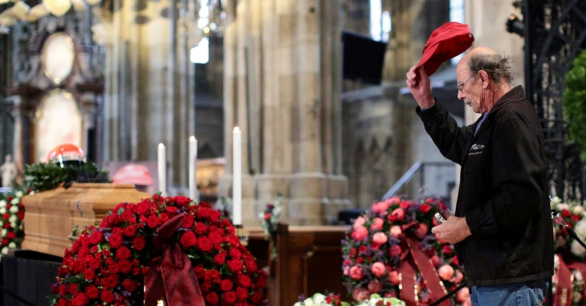 A mourner pays his respects at the coffin of Austrian motor racing great Niki Lauda during his funeral at St Stephen's cathedral in Vienna, Austria May 29, 2019. (Reuters Photo)