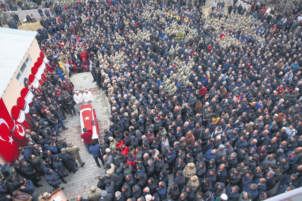 People attend the funeral of Ru0131dvan u00c7evik, one of eight soldiers killed in Afrin, in his hometown Erciu015f in the eastern province of Van.