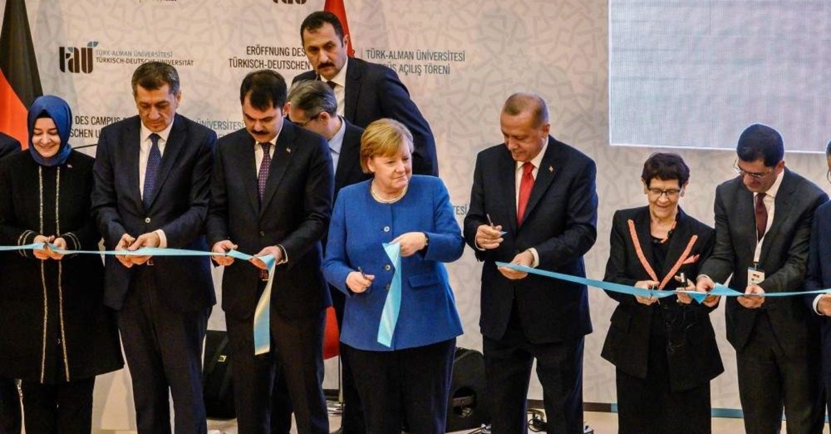 German Chancellor Angela Merkel (C) and President Recep Tayyip Erdo?an attend the official opening ceremony of the Turkish-German University's new campus in Istanbul, Jan. 24, 2020. (AFP Photo)