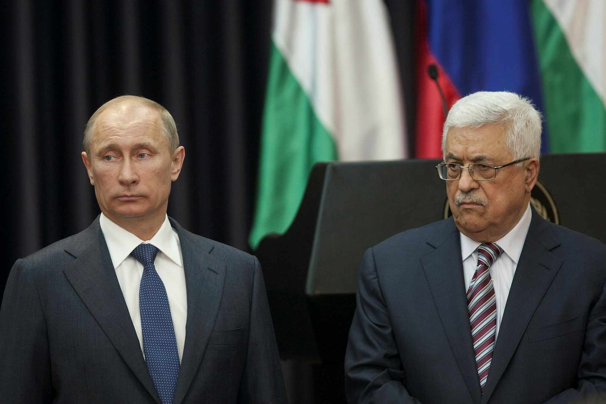 Russian President Vladimir Putin (L) and Palestinian leader Mahmoud Abbas (R) plan to discuss a possible new mediation mechanism to replace the Middle East Quartet.