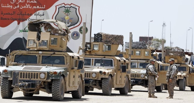 جنود من الجيش الأمريكي في البصرة، ثاني أكبر المدن في العراق، على بعد 550 كيلومتراً جنوب شرق العاصة العراقية بغداد، 27-6-2009 صورة:AFP