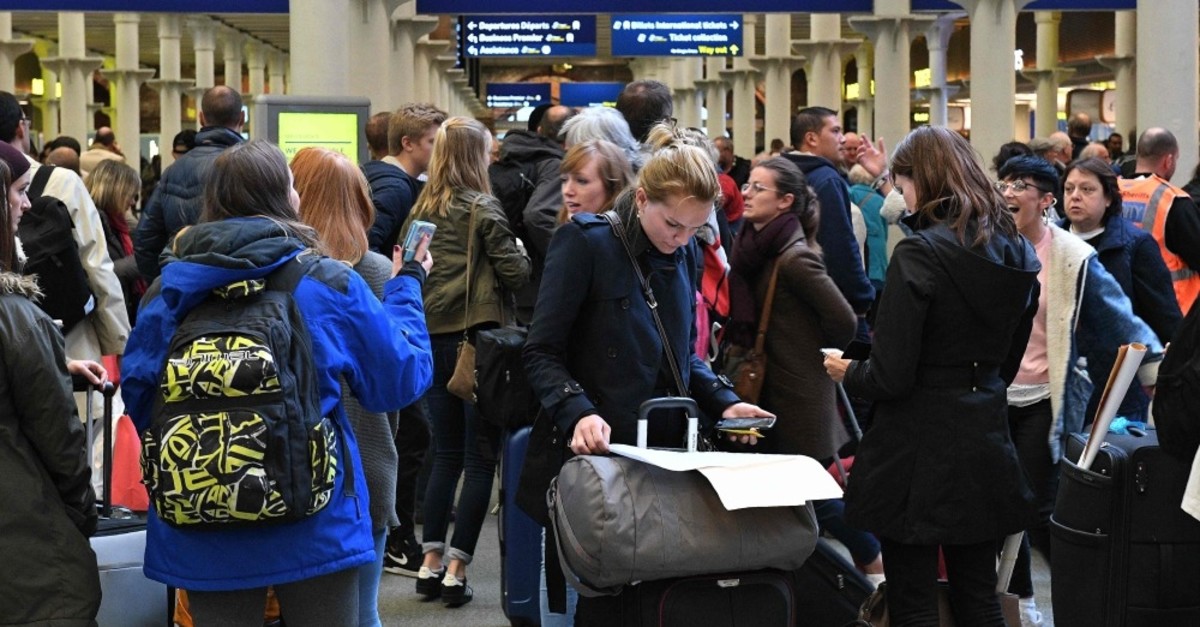 Passengers wait near the International departures area at the Eurostar terminal at the London St. Pancras train station, Oct. 18, 2019.