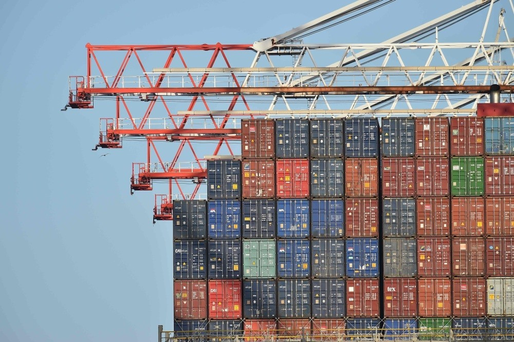 Containers aboard the container ship Benjamin Franklin as it is unloaded at Southampton Container Port, Southampton Docks, Southampton, southern U.K.