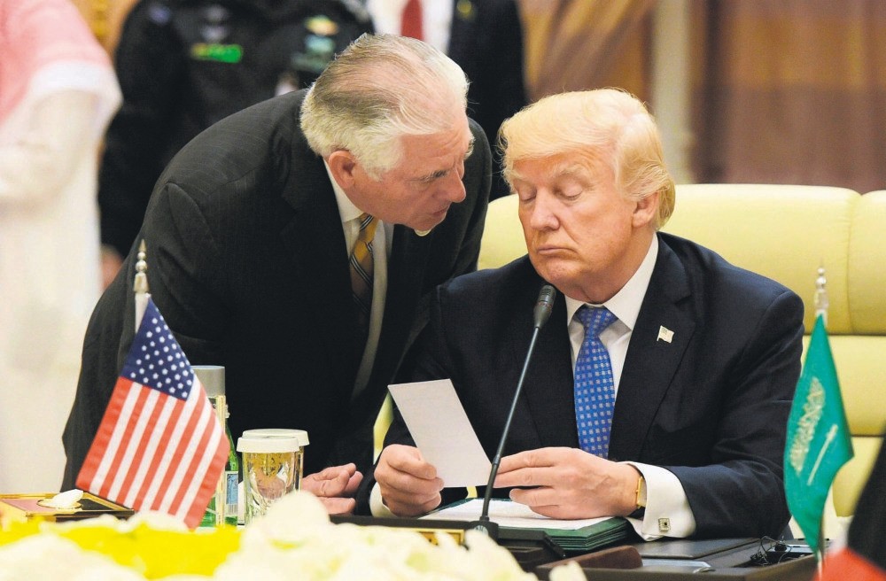 U.S. President Donald Trump listens to Secretary of State Rex Tillerson during a meeting with leaders of the Gulf Cooperation Council at the King Abdulaziz Conference Center in Riyadh on May 21.
