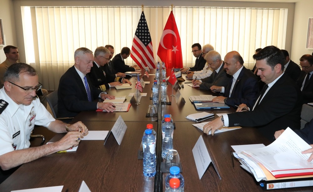Defense Minister Fikri Iu015fu0131k (2nd R) with U.S. Secretary of Defense James Mattis (2nd L) at the NATO Defense Ministers Summit in Brussels, June 28. 