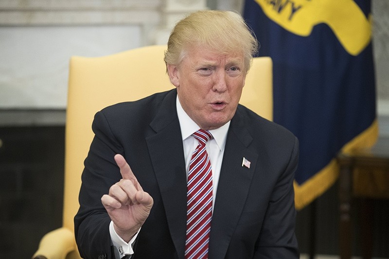 U.S. President Donald J. Trump speaks on domestic violence during a meeting on taxes, in the Oval Office of the White House in Washington, DC, USA, 14 February 2018. (EPA Photo)