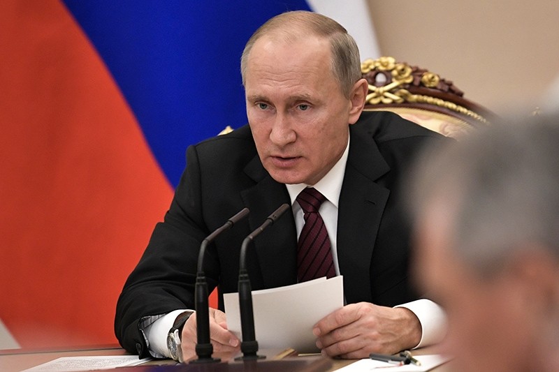 Russian President Vladimir Putin heads the Security Council meeting in Moscow, Russia, Thursday, Oct. 26, 2017. (Alexei Nikolsky, Sputnik, Kremlin Pool Photo via AP)