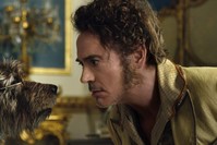 This image released by Universal Pictures shows Dr. John Dolittle, portrayed by Robert Downey Jr., right, with Jip, voiced by Tom Holland, in a scene from ,Dolittle., (AP Photo)