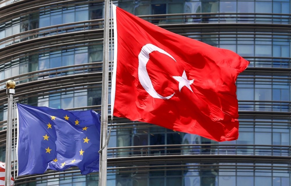 Turkish and European Union flags fly outside a hotel in Istanbul, May 4, 2016.