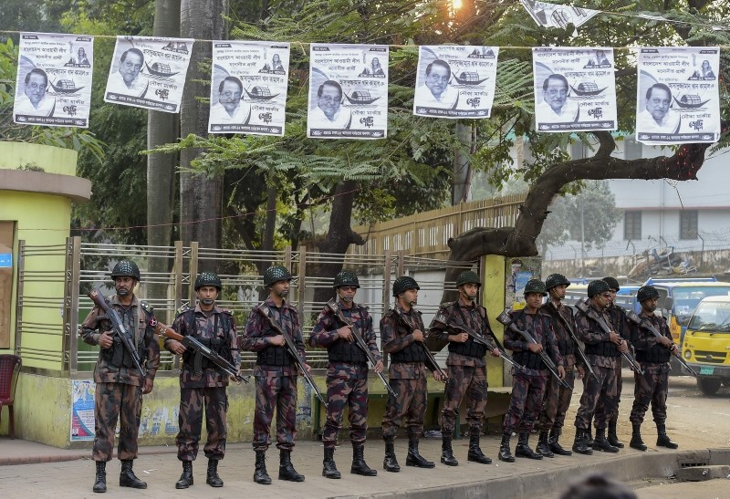 Members of Border Guard Bangladesh (BGB) stand guard in a street for the upcoming election in Dhaka on December 26, 2018. (AFP Photo)