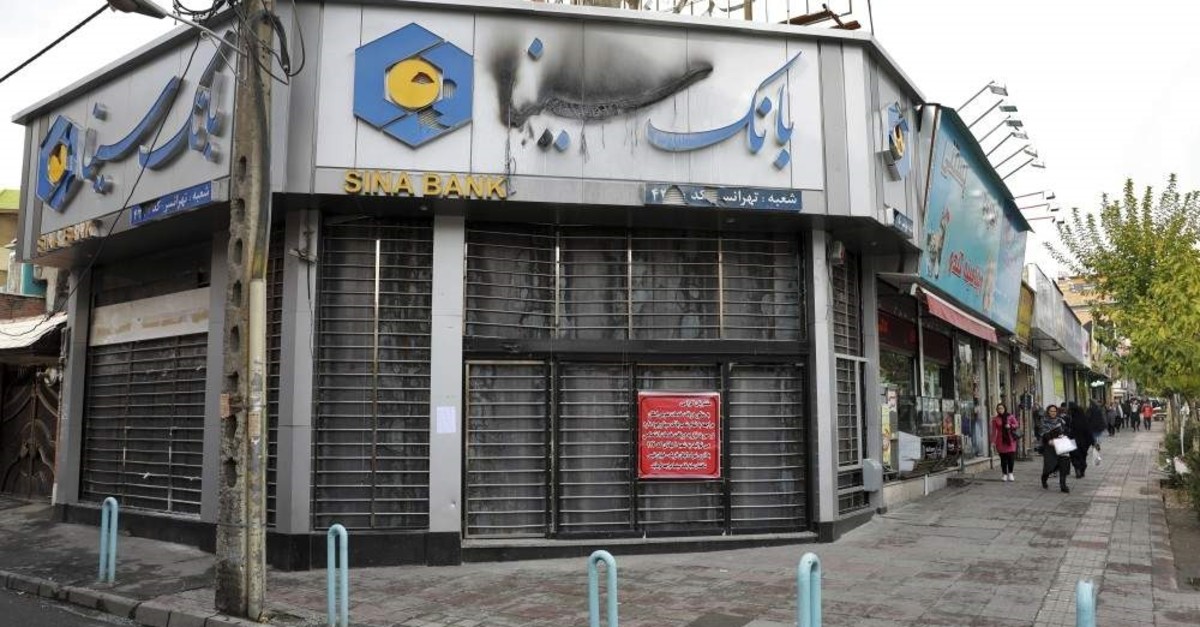 A bank that was attacked and burned during protests remains closed, Tehran, Nov. 20, 2019. (AP Photo)