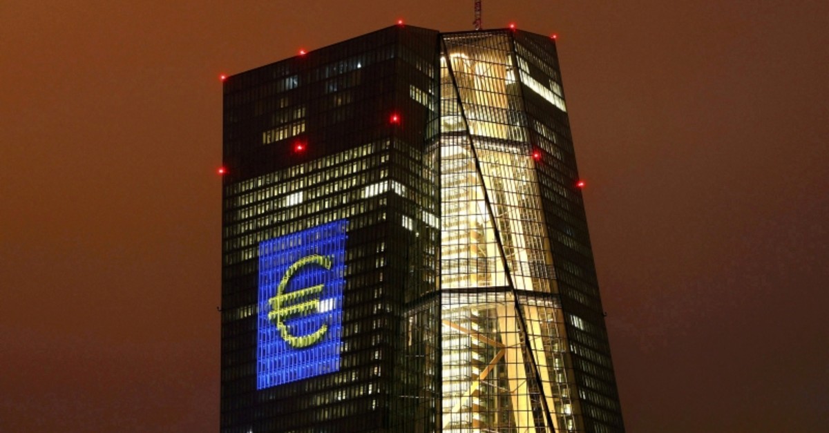The headquarters of the European Central Bank (ECB) are illuminated with a giant euro sign in Frankfurt, Germany, March 12, 2016. (Reuters Photo)